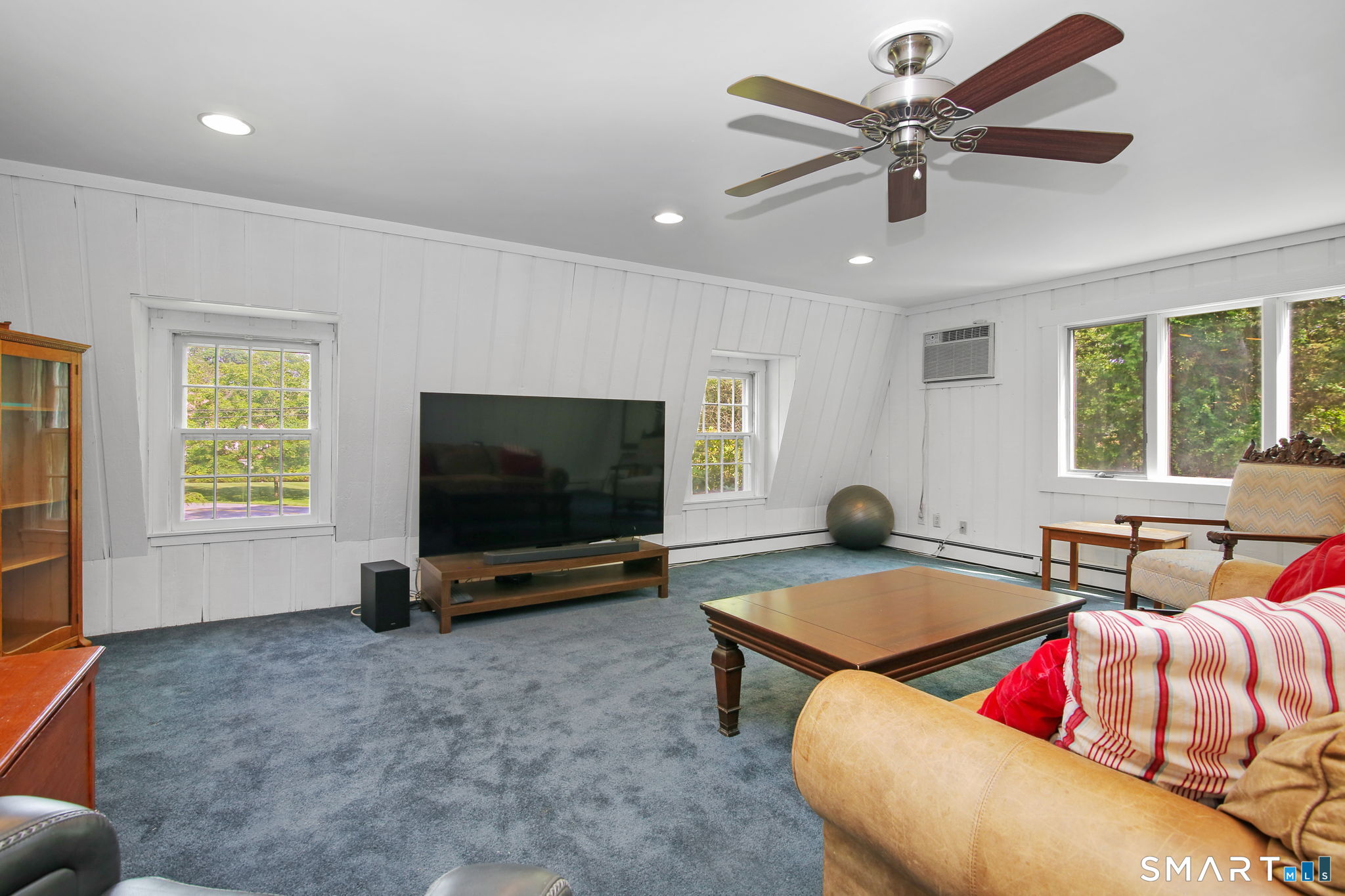 63 Pipers Hill Road Wilton, CT 06897 - Photo 19 of 37 a living room with furniture and a flat screen tv