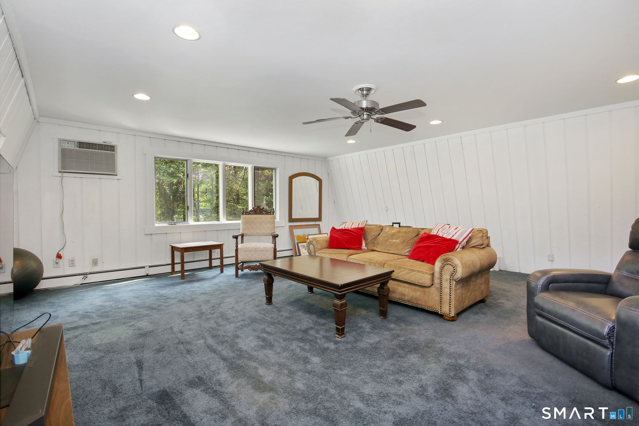 63 Pipers Hill Road Wilton, CT 06897 - Photo 20 of 37 a living room with furniture and a window