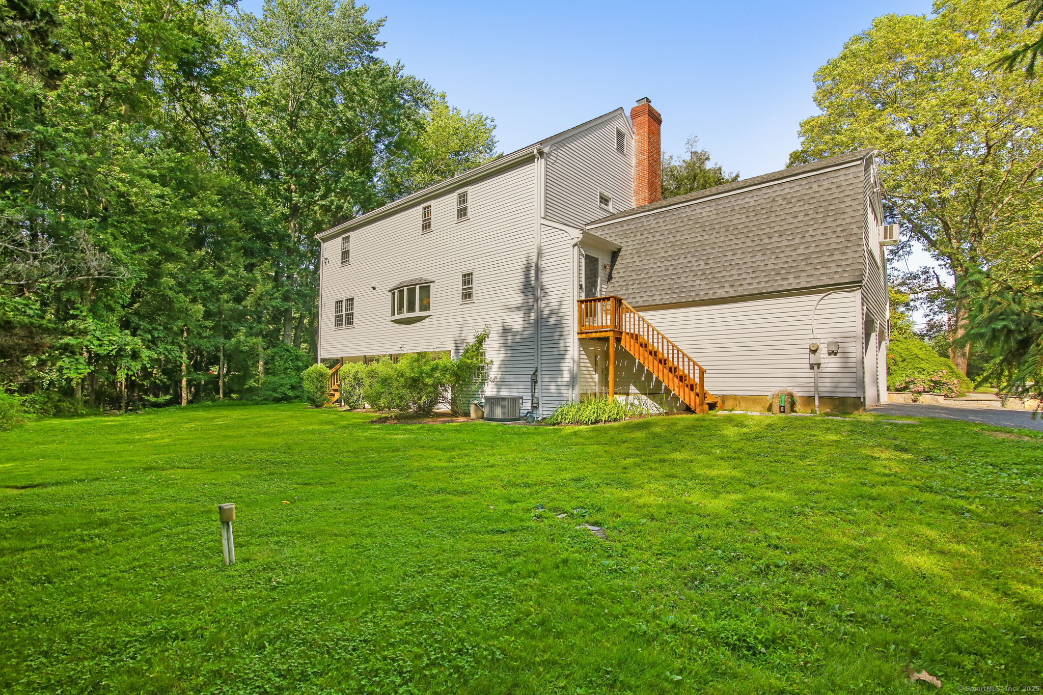 63 Pipers Hill Road Wilton, CT 06897 - Photo 2 of 37 a view of a house with backyard