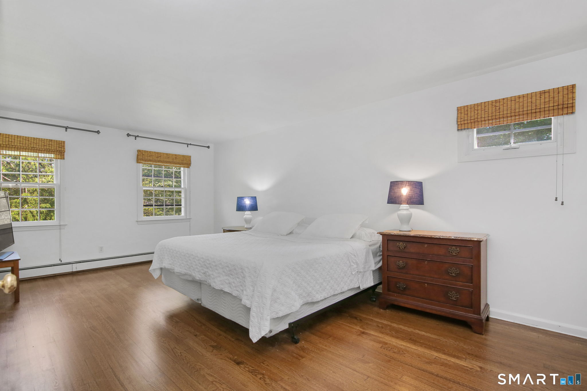 63 Pipers Hill Road Wilton, CT 06897 - Photo 21 of 37 a bedroom with a bed and a window