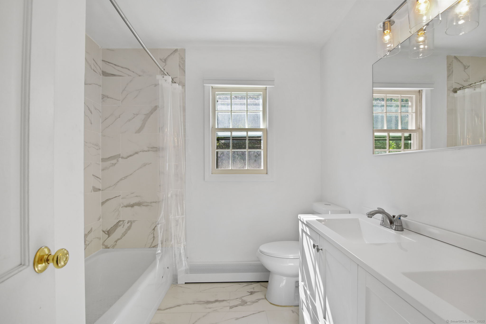 63 Pipers Hill Road Wilton, CT 06897 - Photo 22 of 37 a bathroom with a sink a toilet and shower