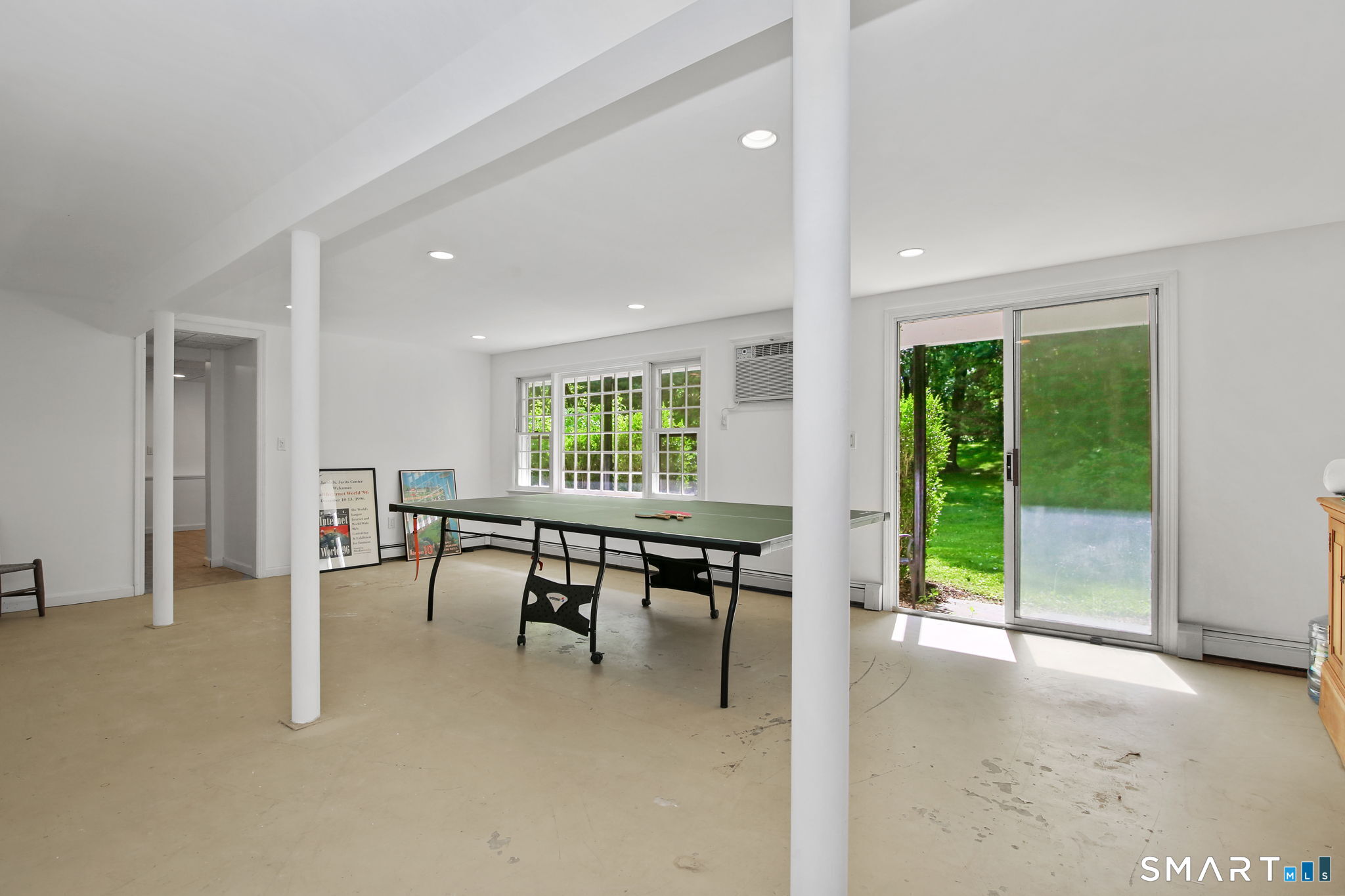 63 Pipers Hill Road Wilton, CT 06897 - Photo 26 of 37 a dining room with furniture and a floor to ceiling window
