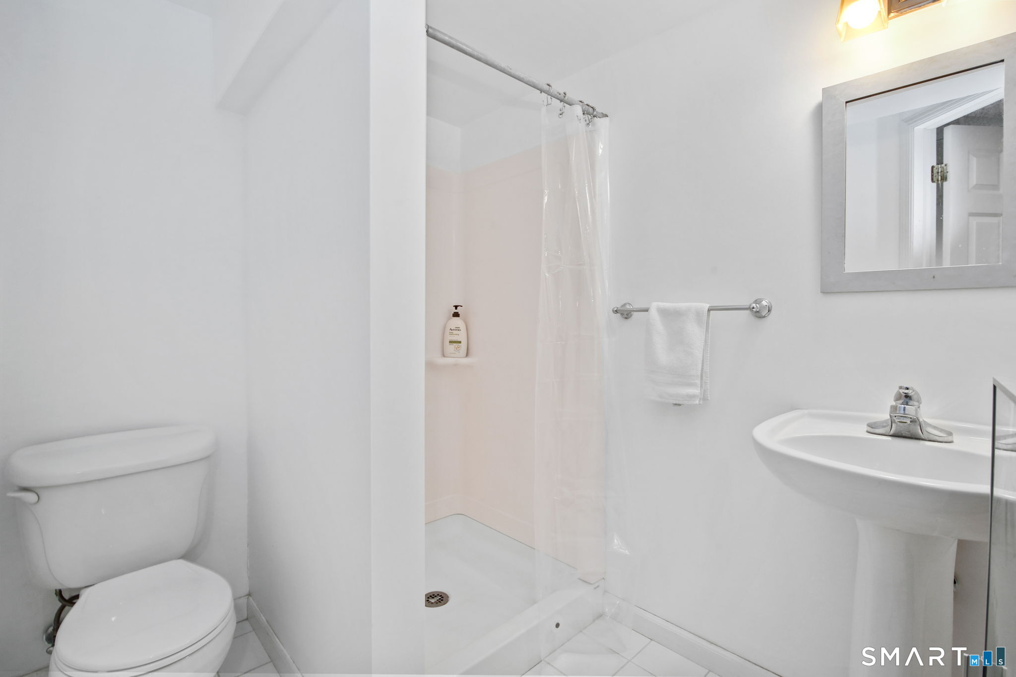 63 Pipers Hill Road Wilton, CT 06897 - Photo 28 of 37 a bathroom with a sink toilet and shower