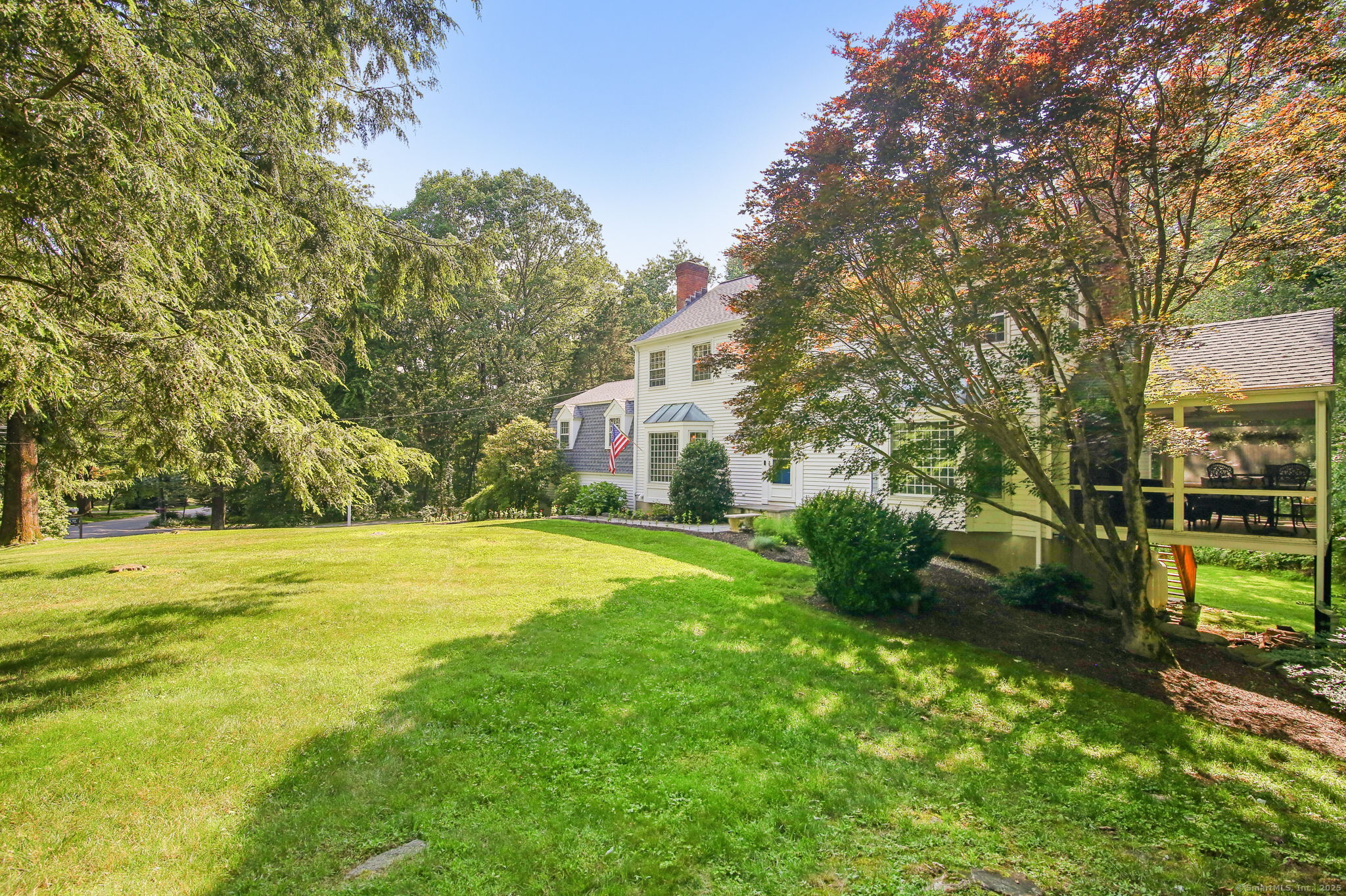 63 Pipers Hill Road Wilton, CT 06897 - Photo 33 of 37 a yellow building with trees in front of it