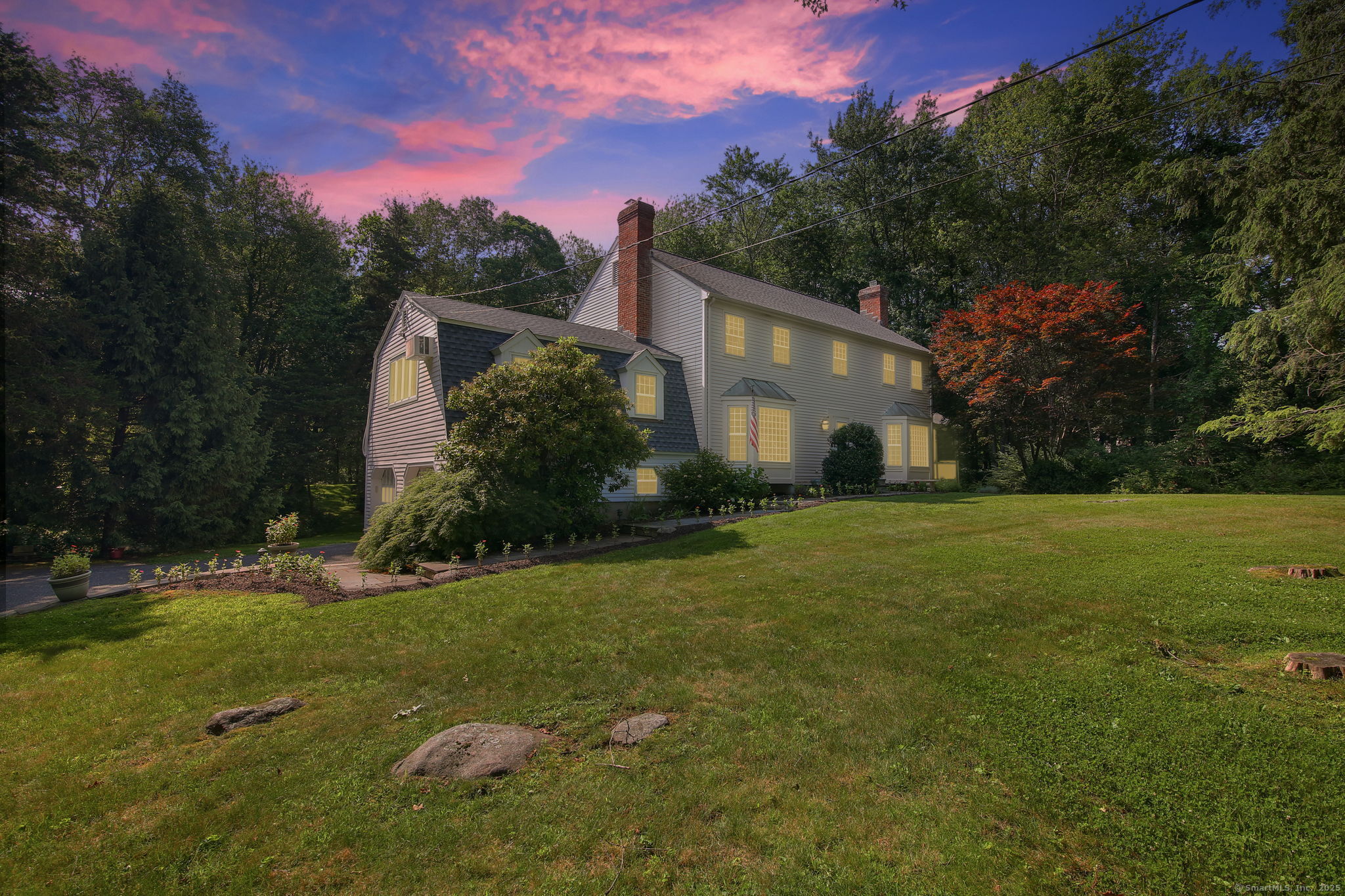 63 Pipers Hill Road Wilton, CT 06897 - Photo 37 of 37 a front view of a house with a yard