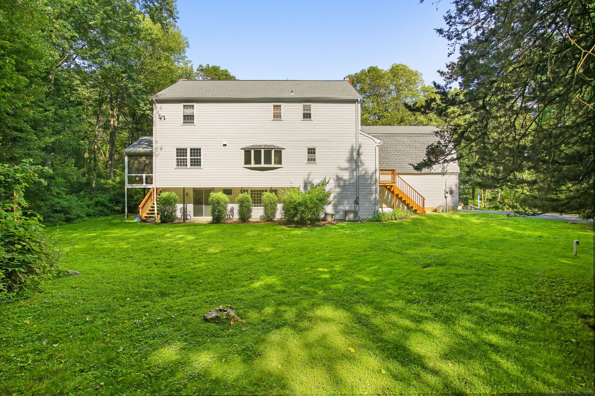 63 Pipers Hill Road Wilton, CT 06897 - Photo 4 of 37 a view of a back yard of the house