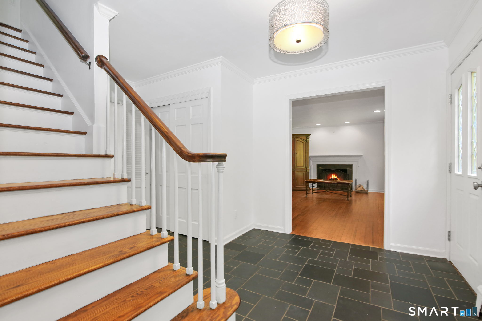63 Pipers Hill Road Wilton, CT 06897 - Photo 7 of 37 a view of entryway and hall with wooden floor