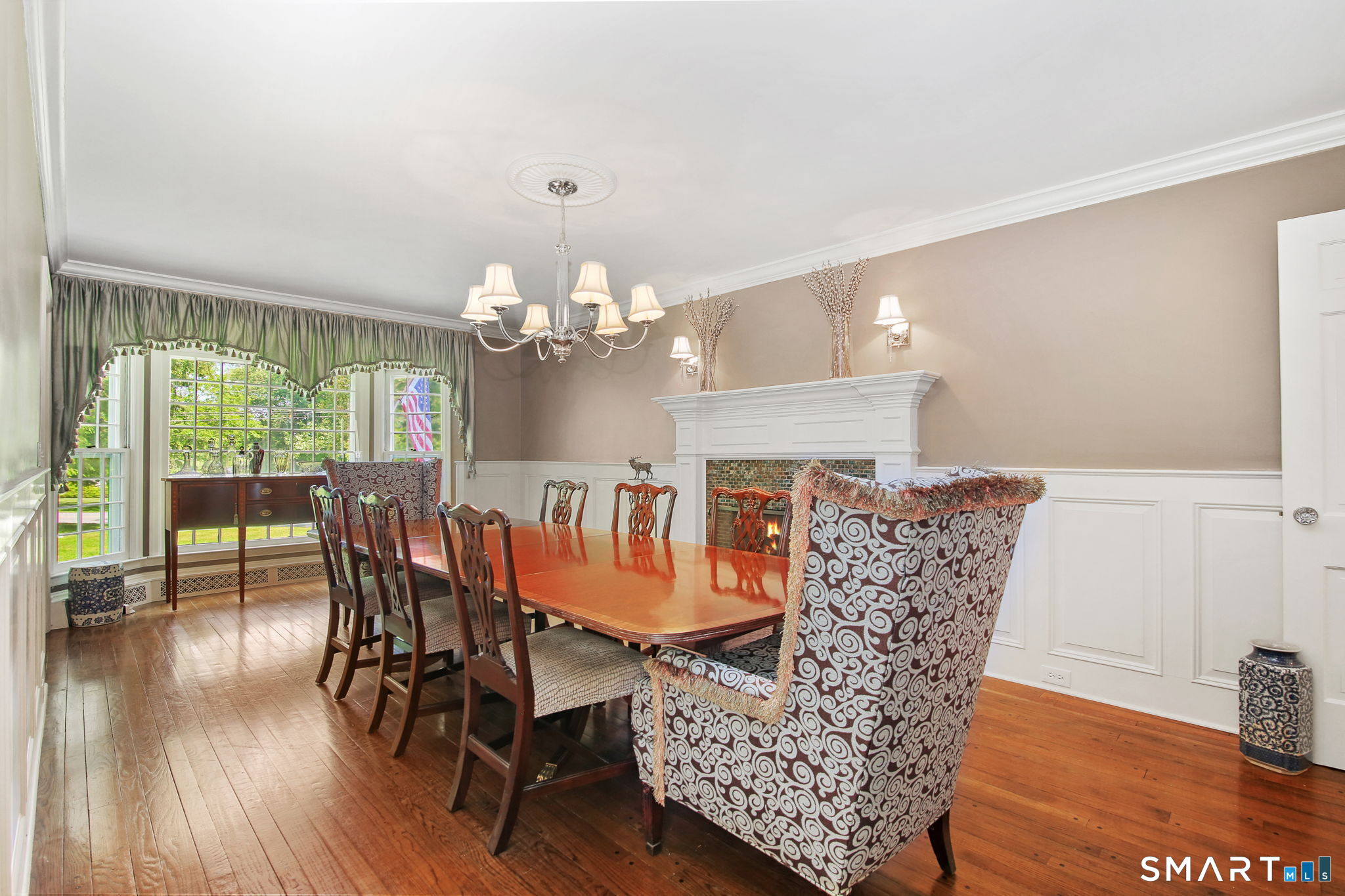 63 Pipers Hill Road Wilton, CT 06897 - Photo 8 of 37 a view of a dining room with furniture window and wooden floor