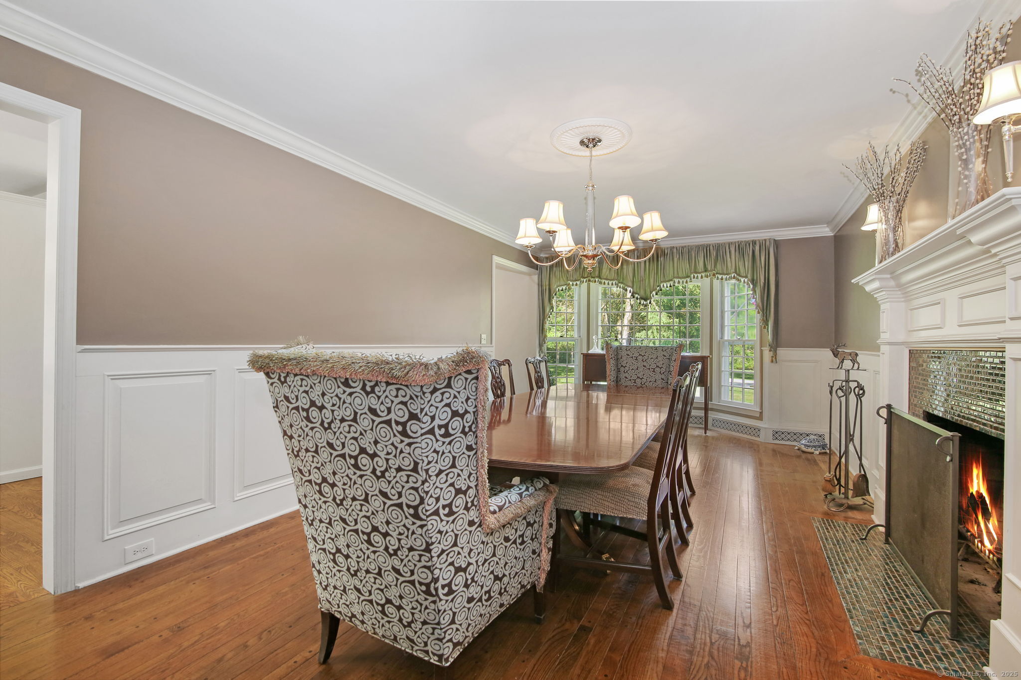 63 Pipers Hill Road Wilton, CT 06897 - Photo 9 of 37 a view of a dining room with furniture and wooden floor