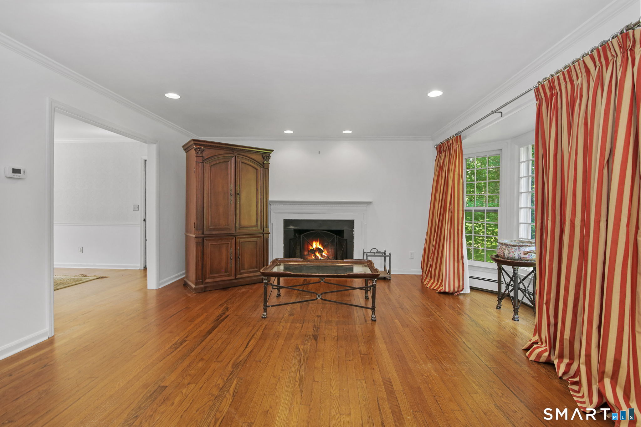 63 Pipers Hill Road Wilton, CT 06897 - Photo 10 of 37 a living room with furniture and a fireplace