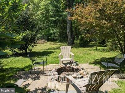 181 Disbrow Hill Road Monroe Township, NJ 08831 - Photo 11 of 21 a view of backyard with seating area and green space