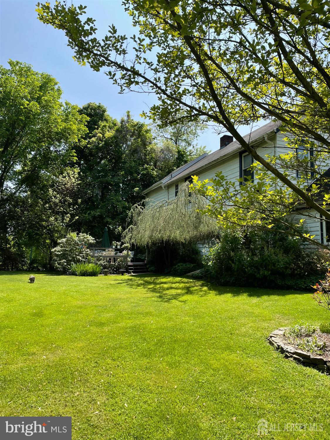 181 Disbrow Hill Road Monroe Township, NJ 08831 - Photo 6 of 21 a view of yard with swimming pool and green space