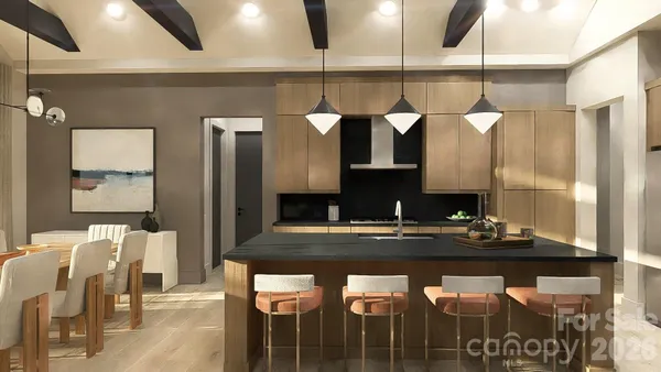 a kitchen with a counter and chairs