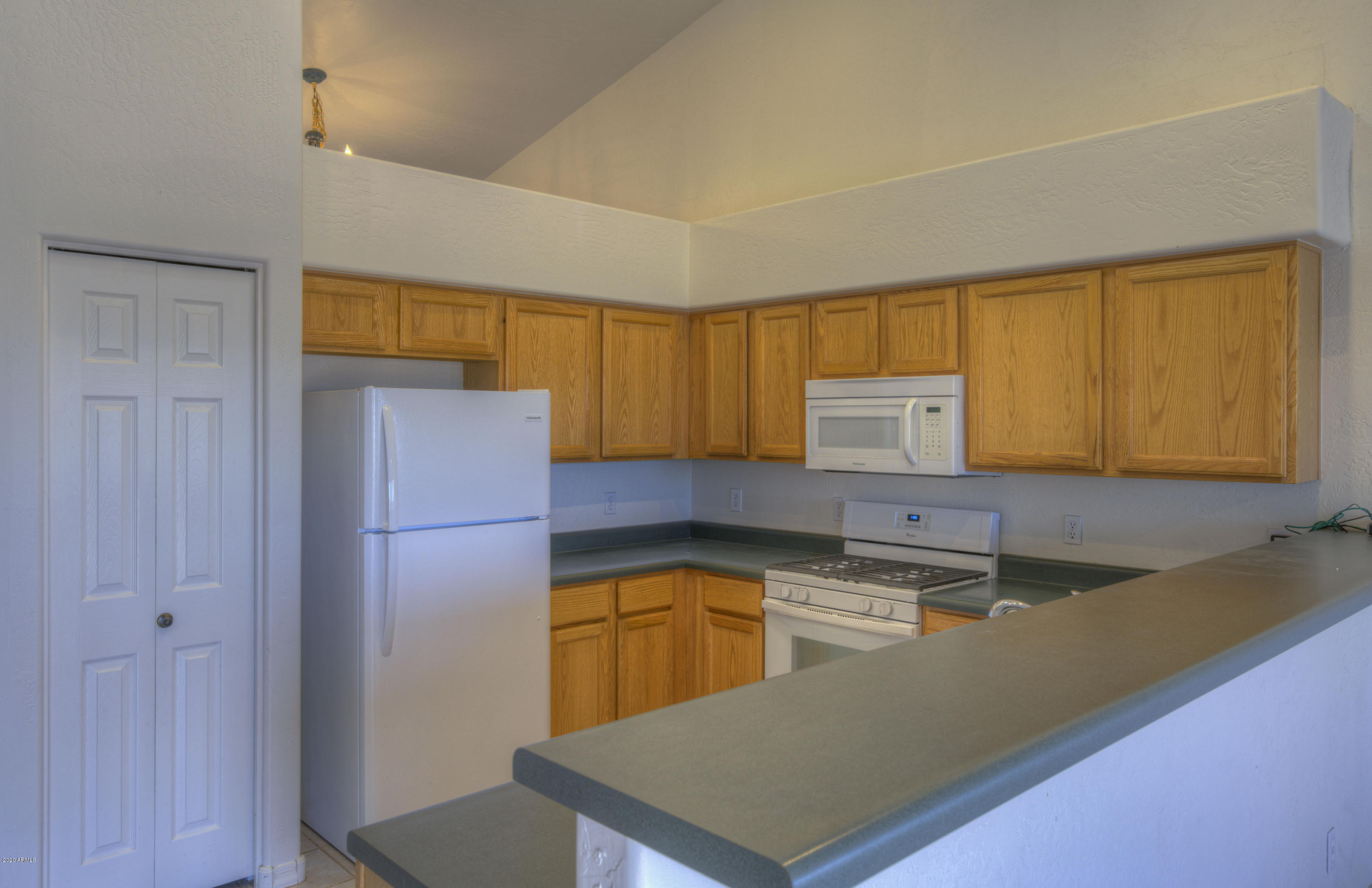 501 East Cloud Road Phoenix, AZ 85086 - Photo 15 of 29 Kitchen with high pot shelves