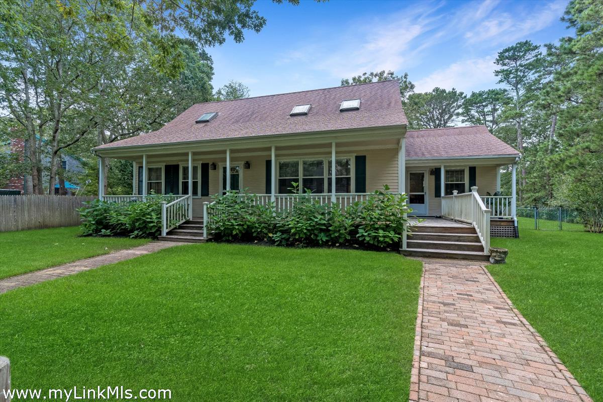 2 Farm Path Road Oak Bluffs, MA 02557 - Photo 2 of 37 a front view of a house with a garden