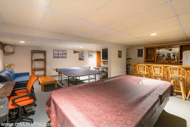 a bedroom with furniture and wooden floor