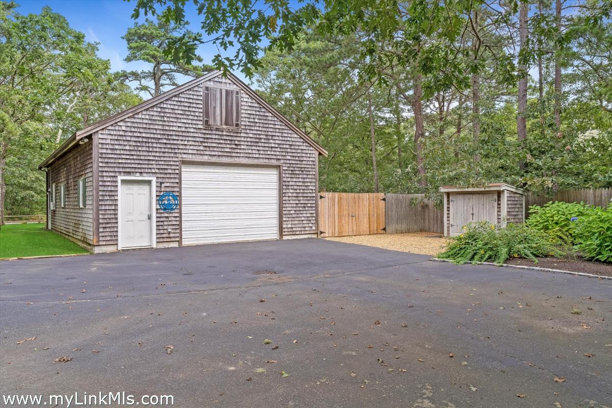 2 Farm Path Road Oak Bluffs, MA 02557 - Photo 29 of 37 a view of a house with a yard and garage