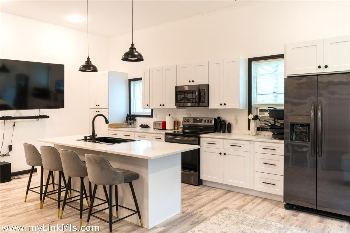 2 Farm Path Road Oak Bluffs, MA 02557 - Photo 31 of 37 a kitchen with appliances a sink cabinets and a counter top space