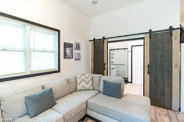 a living room with furniture and a window