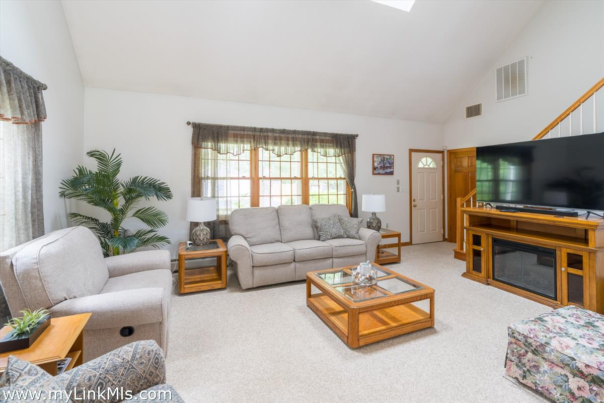 2 Farm Path Road Oak Bluffs, MA 02557 - Photo 5 of 37 a living room with furniture and a flat screen tv