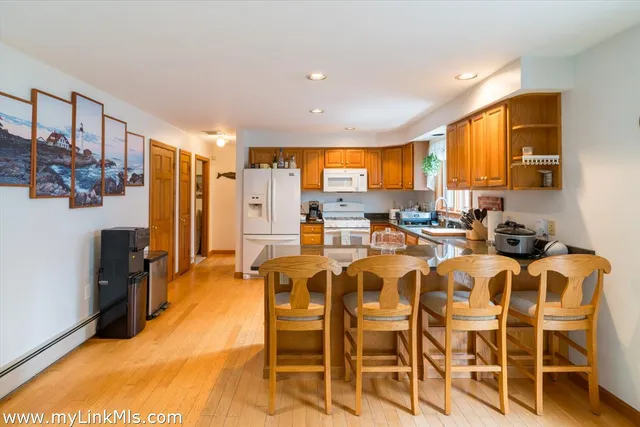 a very nice looking dining room with furniture