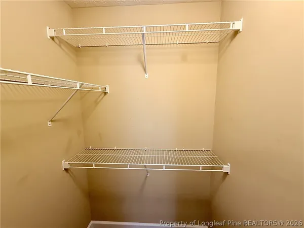 a view of a room with racks on the wall