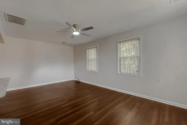 a bathroom with a shower a sink and a mirror