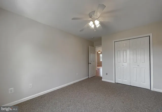 a utility room with cabinets dryer and washer