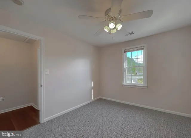 an aerial view of a house with a lake view