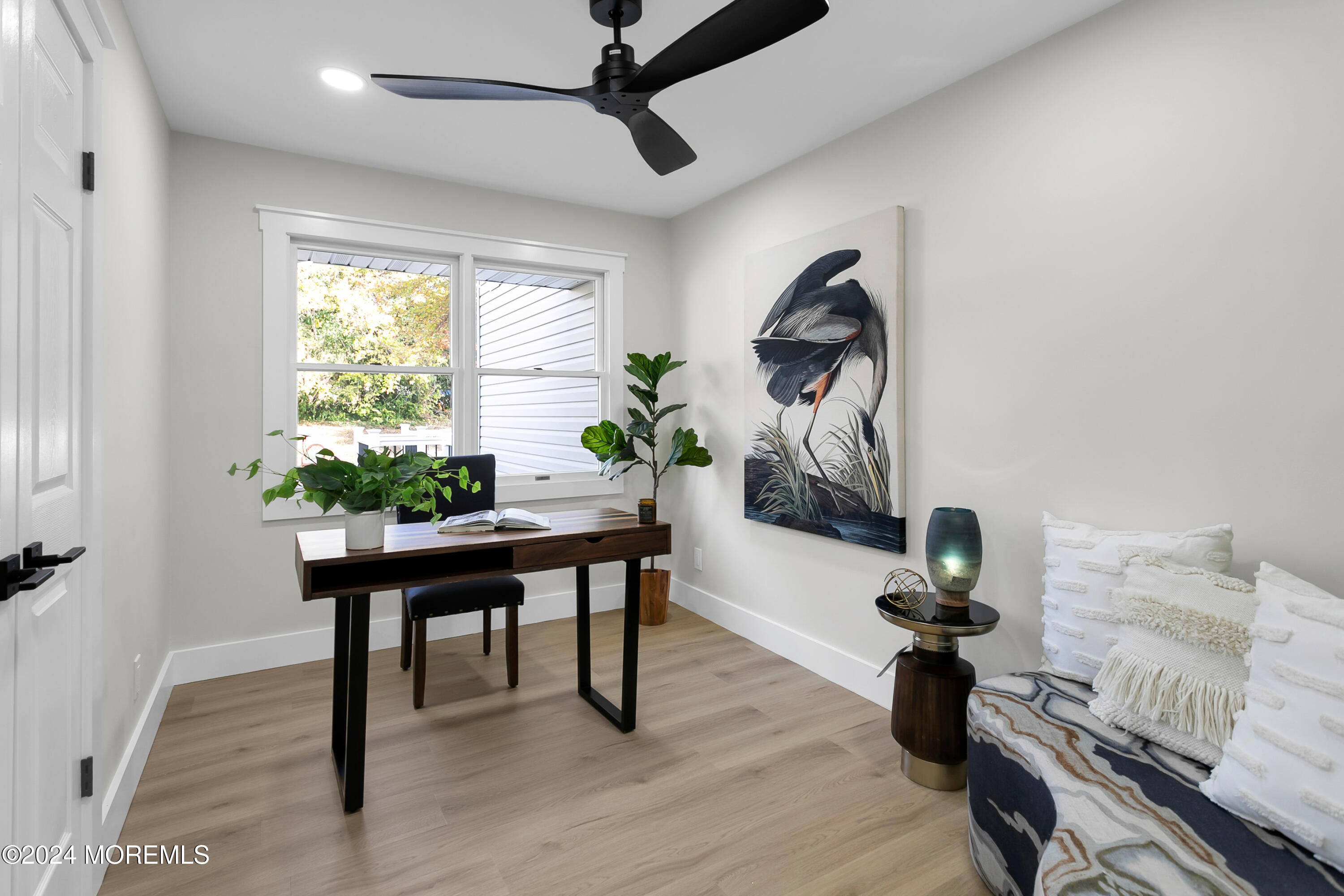 651 Hopping Road Belford, NJ 07718 - Photo 13 of 66 a view of a workspace room with wooden floor table and windows