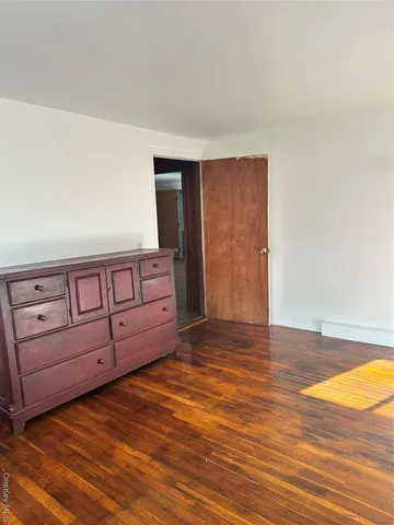 a view of a livingroom with wooden floor