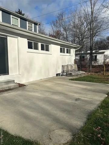 a front view of a house with a outdoor space