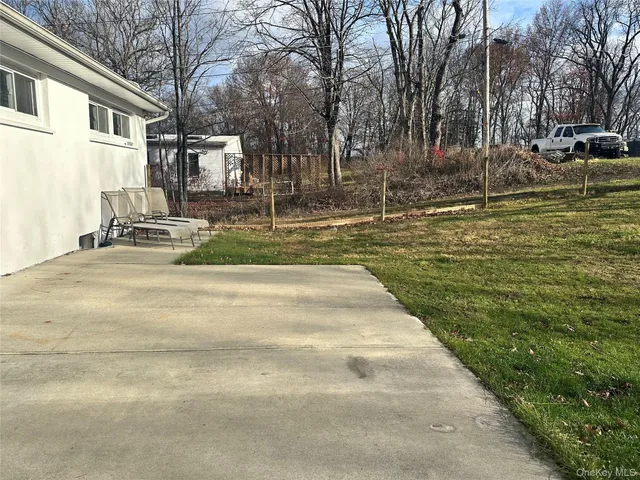 a view of a patio with a yard