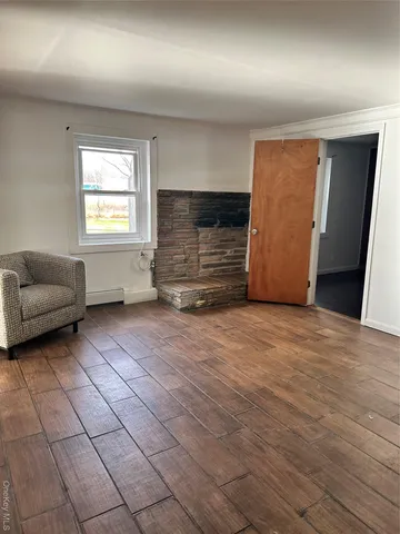 a view of livingroom with furniture and a window