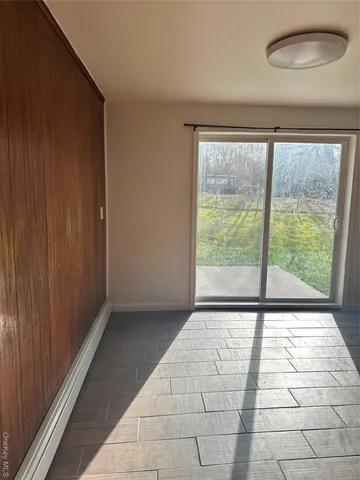 a view of an empty room with a window