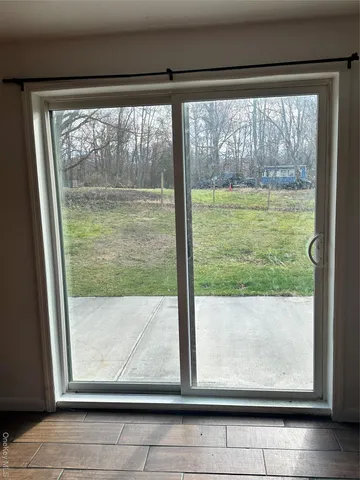 a view of a room with window an outdoor space