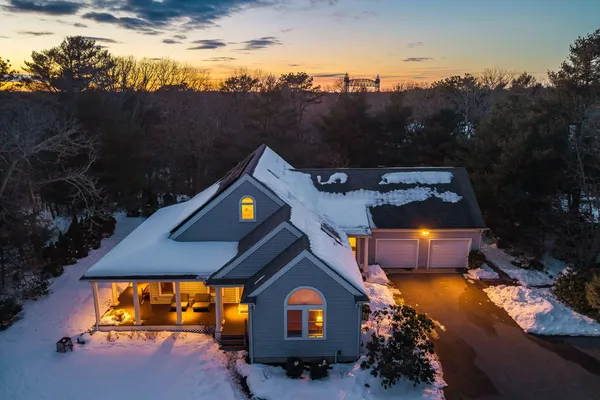 an aerial view of a house with a yard basket ball court and outdoor seating