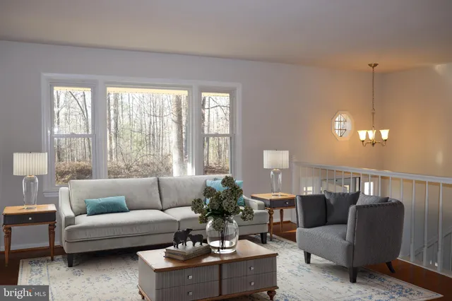 a kitchen with granite countertop stainless steel appliances a sink window and cabinets