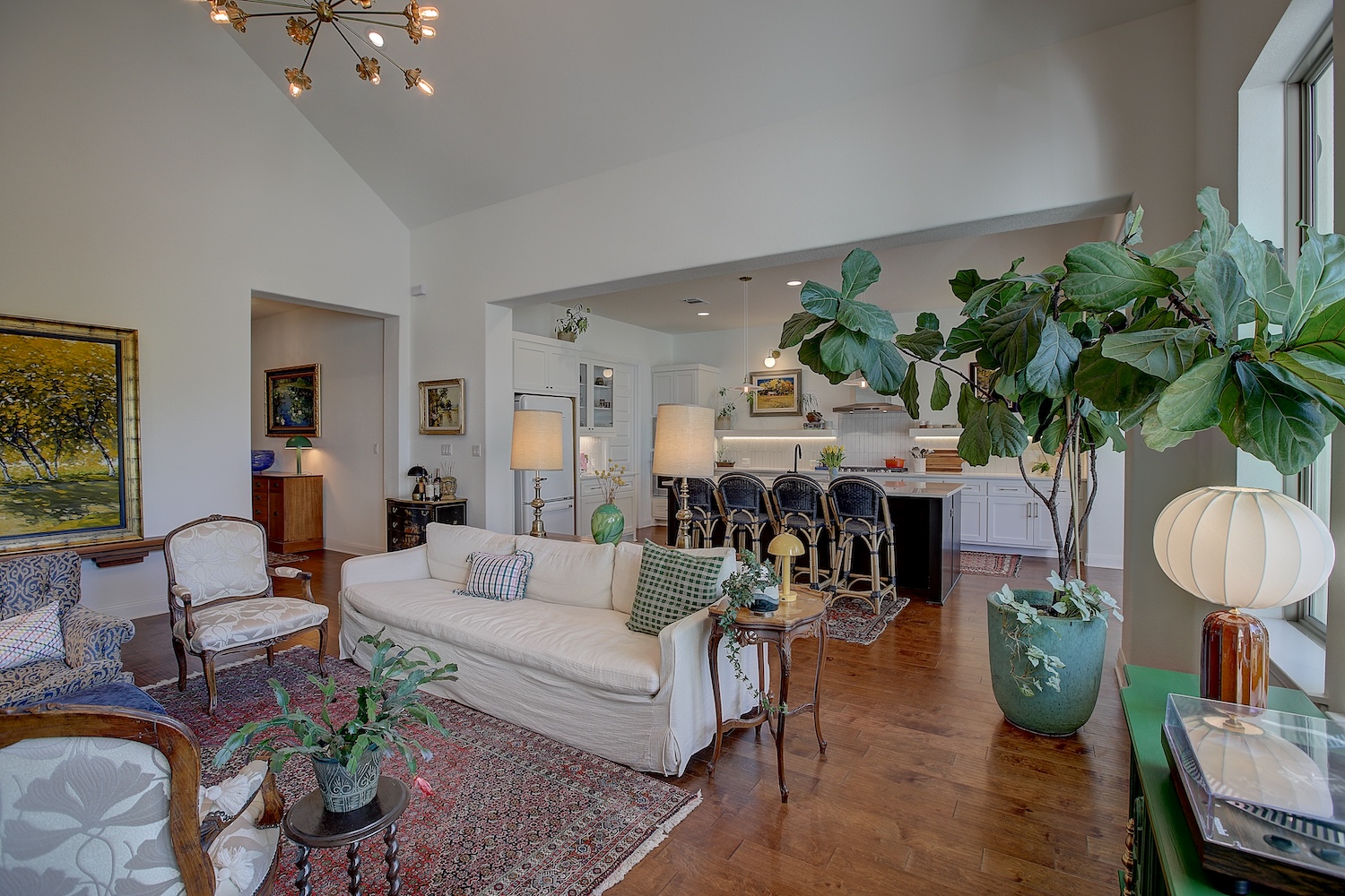 129 Hollytree Court Georgetown, TX 78628 - Photo 6 of 40 The family room has vaulted ceilings, custom lighting, a gas fireplace, and views through every window.