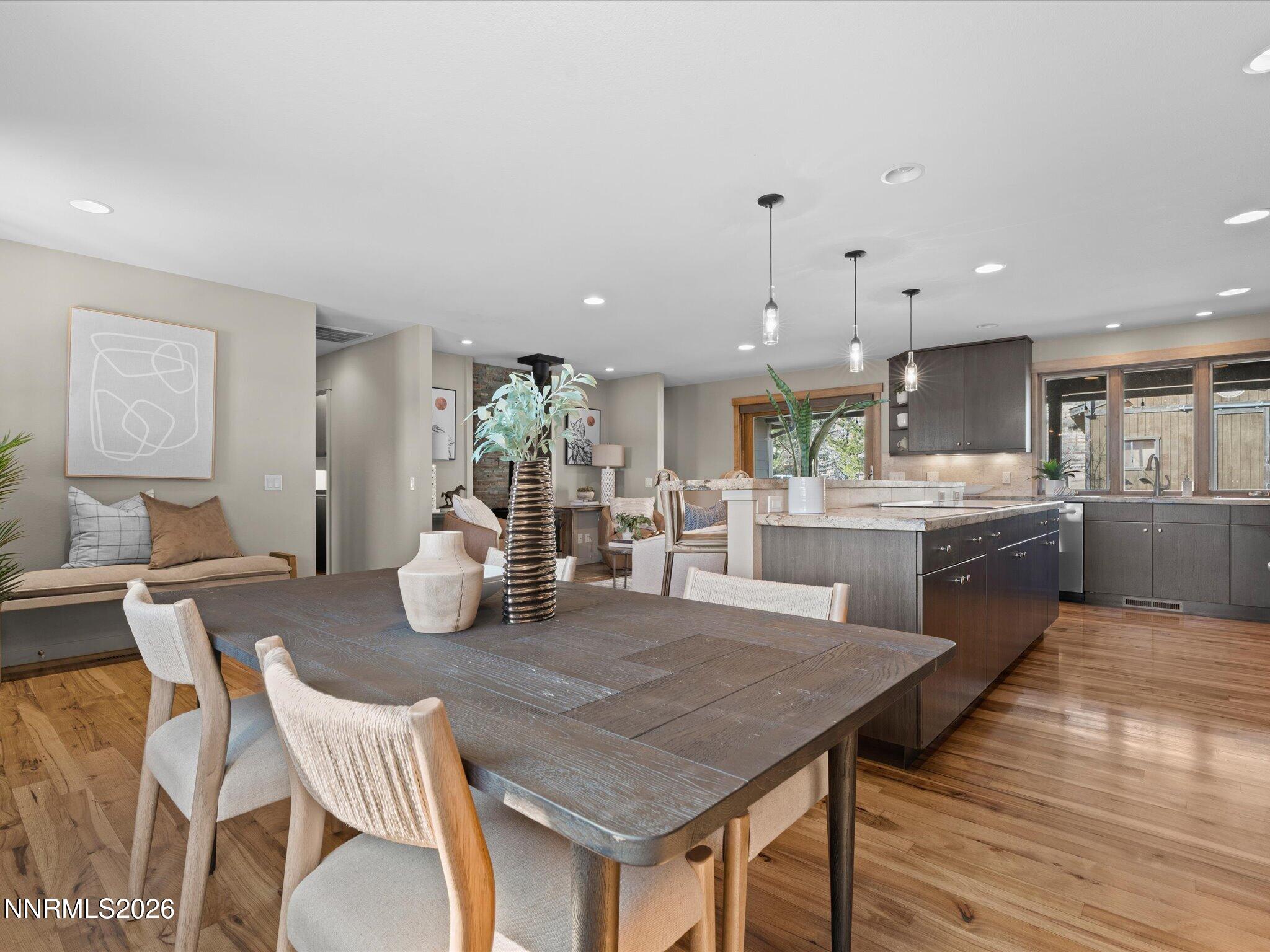 20 Connie Way Reno, NV 89521 - Photo 12 of 69 a kitchen with stainless steel appliances granite countertop a kitchen island a stove a table and chairs
