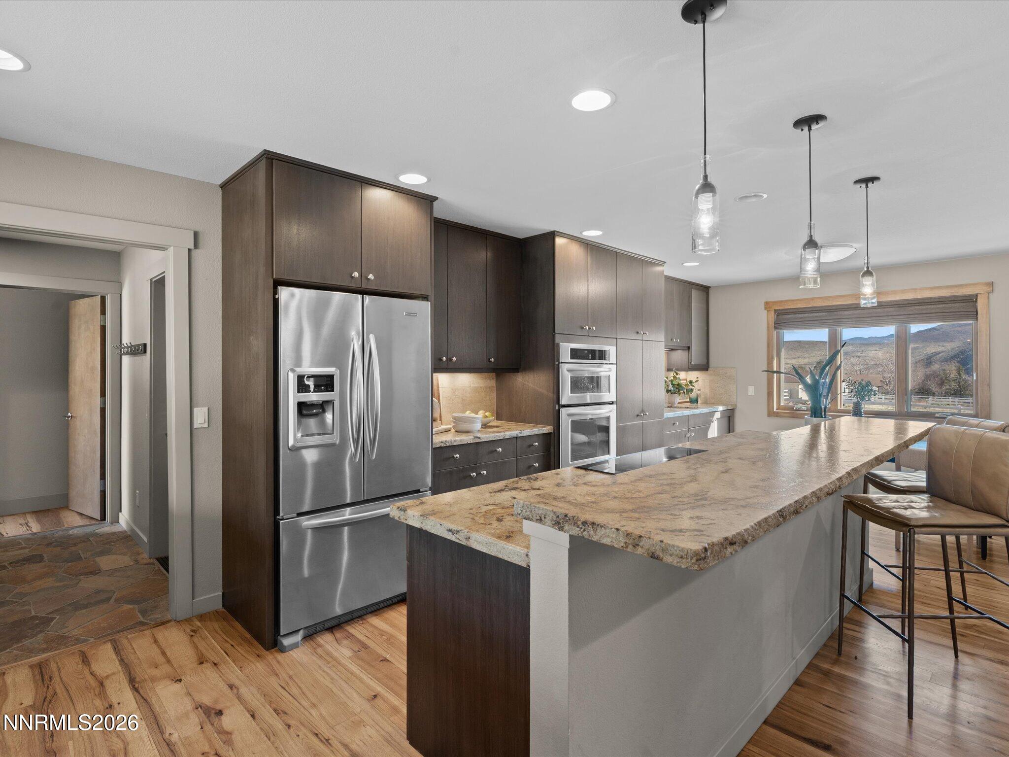 20 Connie Way Reno, NV 89521 - Photo 13 of 69 a kitchen with granite countertop a refrigerator and a sink