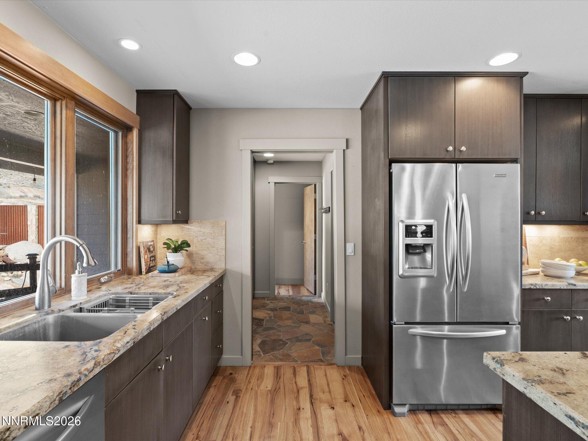 20 Connie Way Reno, NV 89521 - Photo 14 of 69 a kitchen with kitchen island granite countertop a refrigerator and a sink