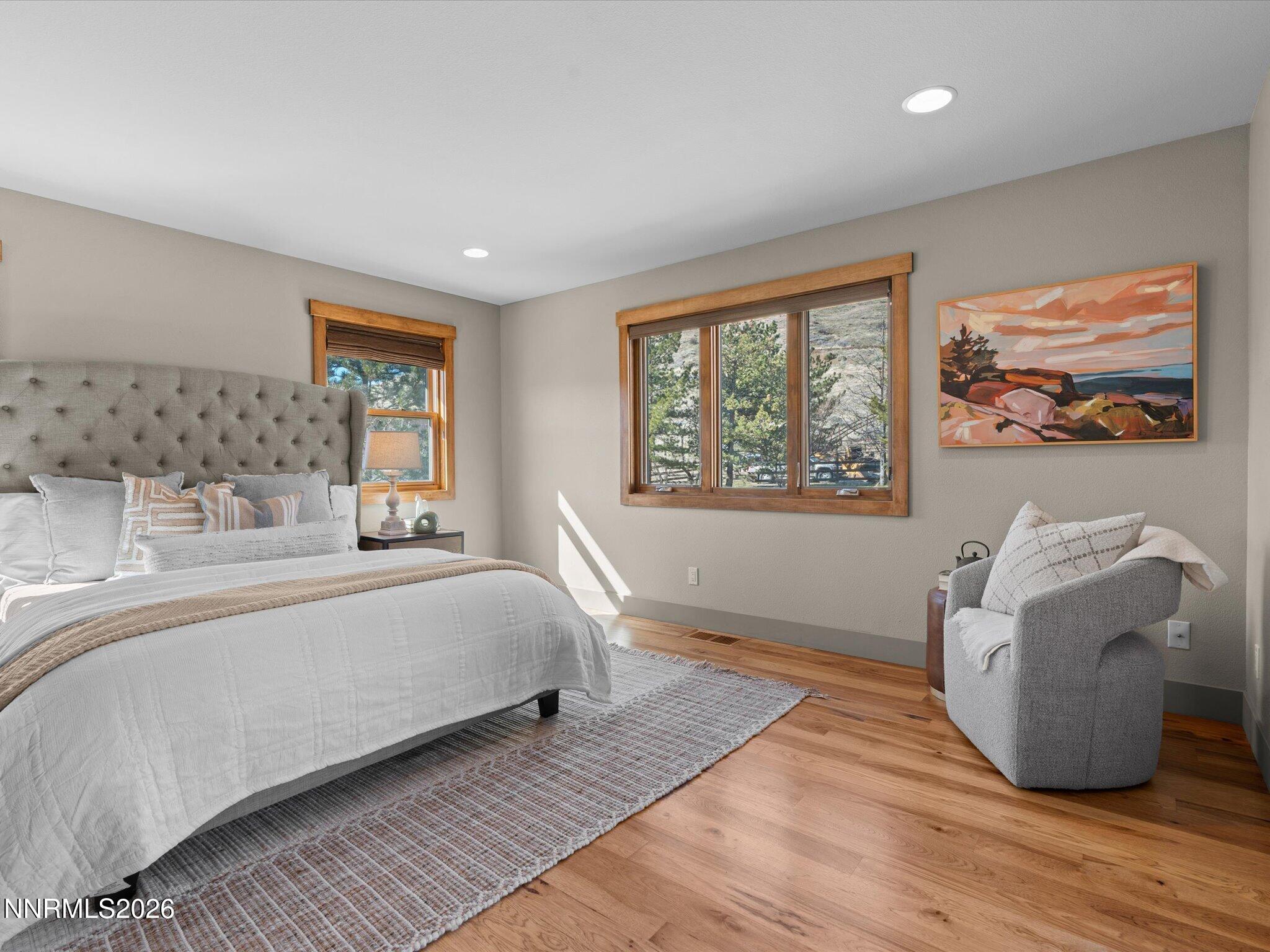 20 Connie Way Reno, NV 89521 - Photo 22 of 69 a spacious bedroom with a large bed and a window