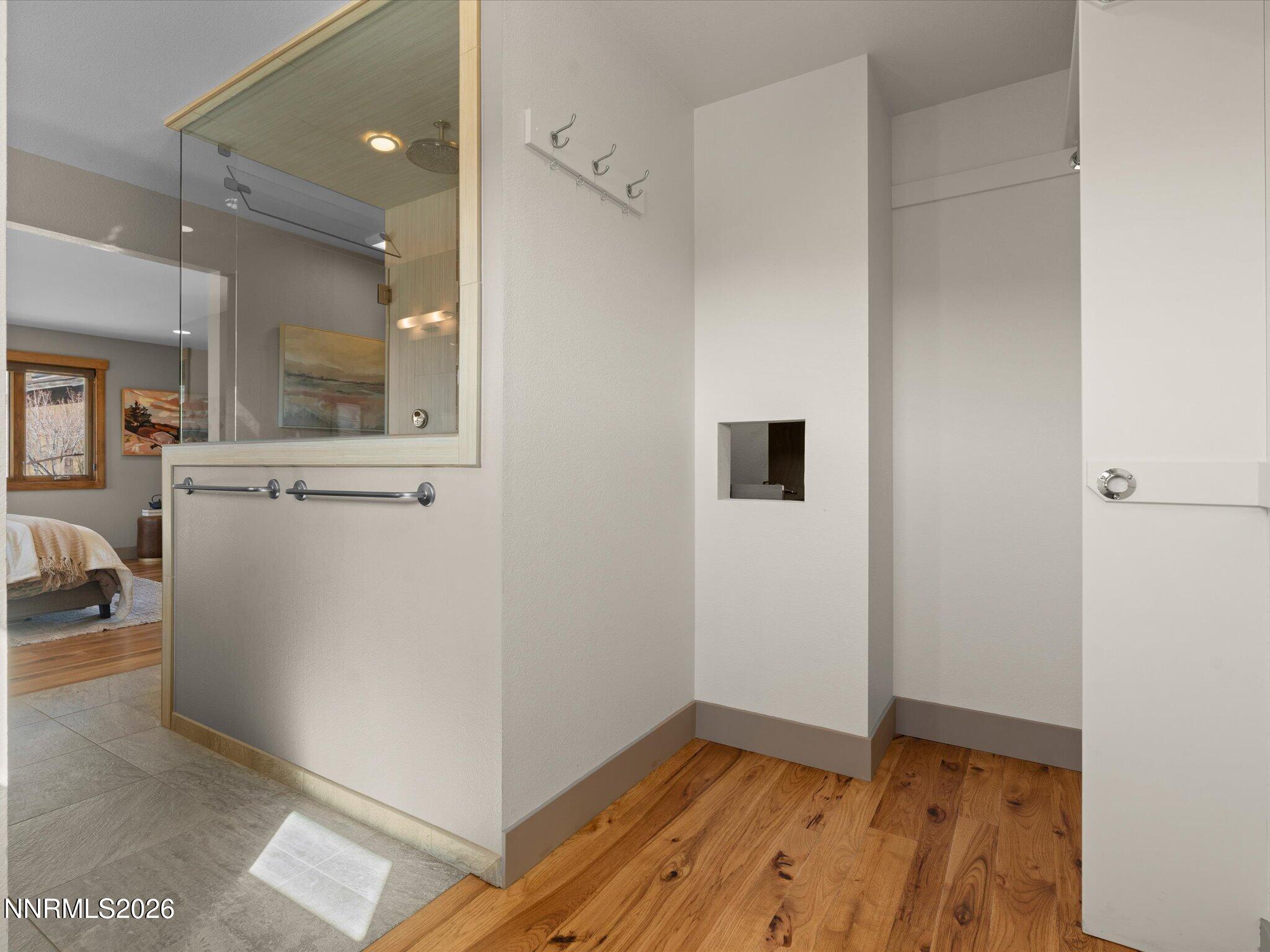 20 Connie Way Reno, NV 89521 - Photo 30 of 69 a view of a hallway with wooden floor and a bathroom