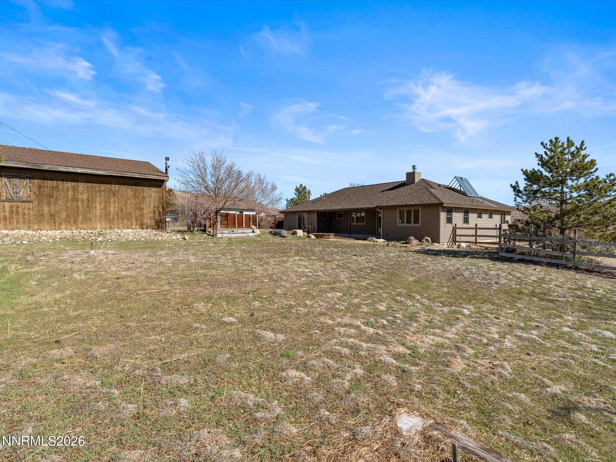20 Connie Way Reno, NV 89521 - Photo 57 of 69 a front view of a house with a yard and fountain