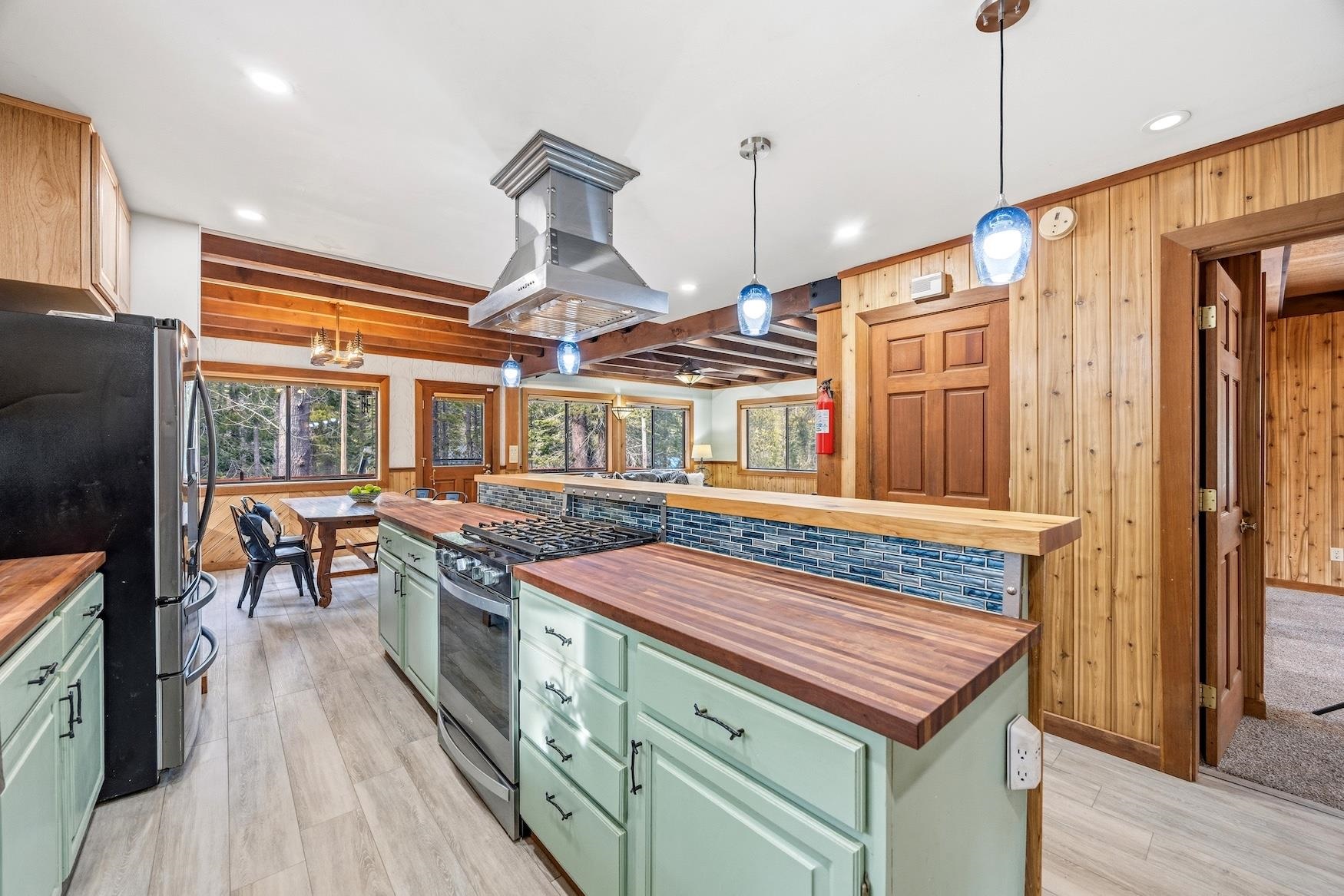 51379 Donner Pass Road Soda Springs, CA 95728 - Photo 8 of 22 a kitchen with stainless steel appliances granite countertop a stove and refrigerator