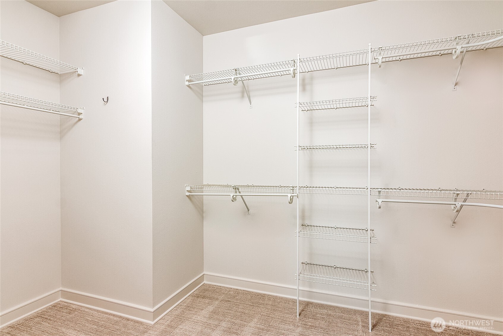 21 West Comstock Street, Unit 102 Seattle, WA 98119 - Photo 14 of 22 a view of walk in closet with empty racks