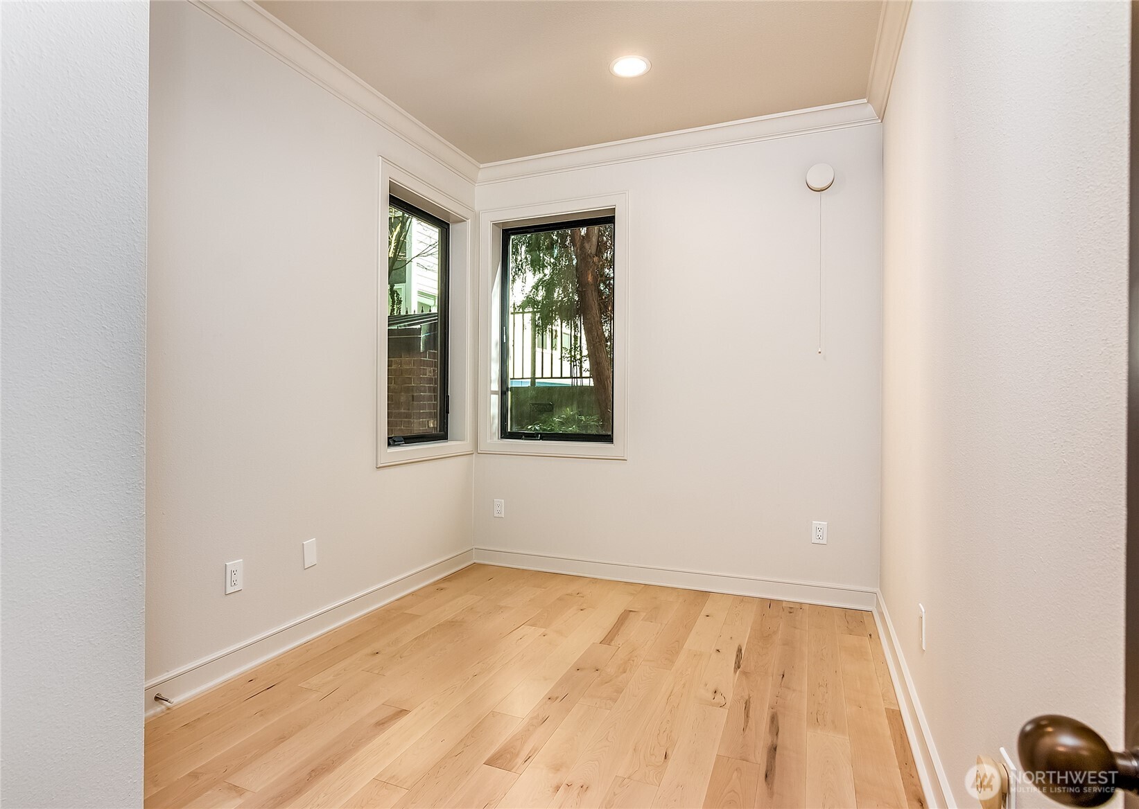 21 West Comstock Street, Unit 102 Seattle, WA 98119 - Photo 16 of 22 an empty room with a window