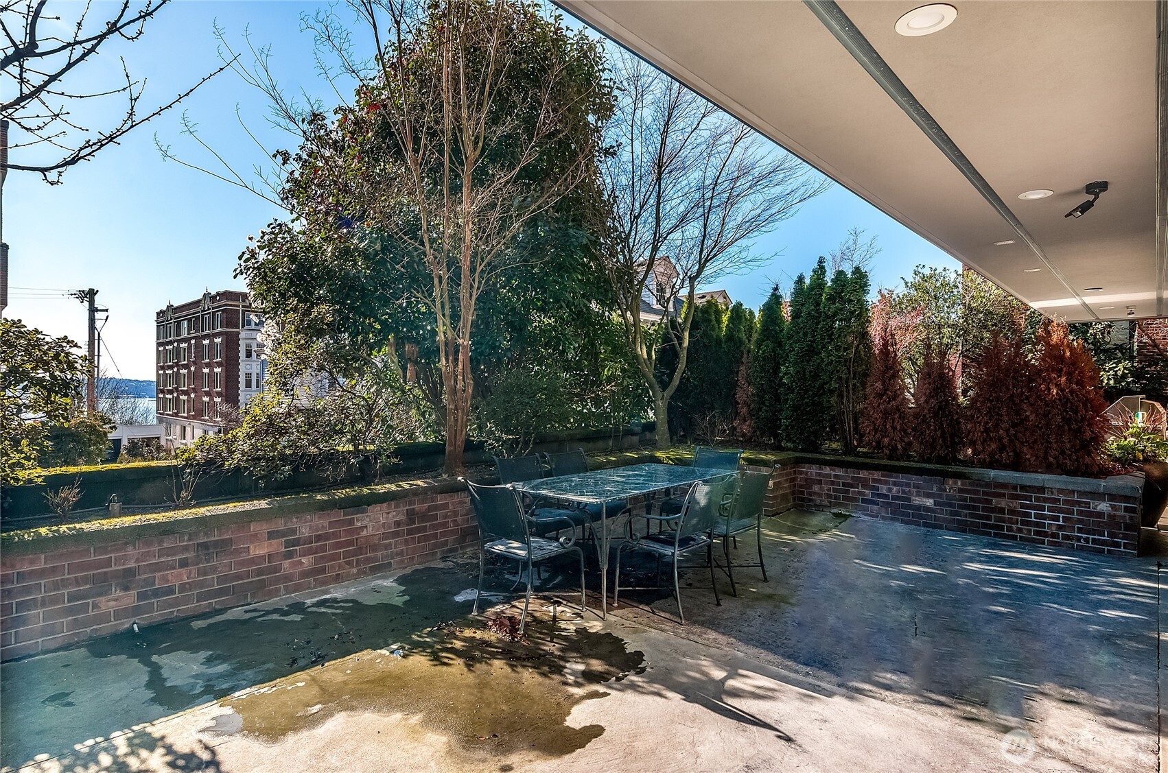 21 West Comstock Street, Unit 102 Seattle, WA 98119 - Photo 18 of 22 a view of a backyard with sitting area