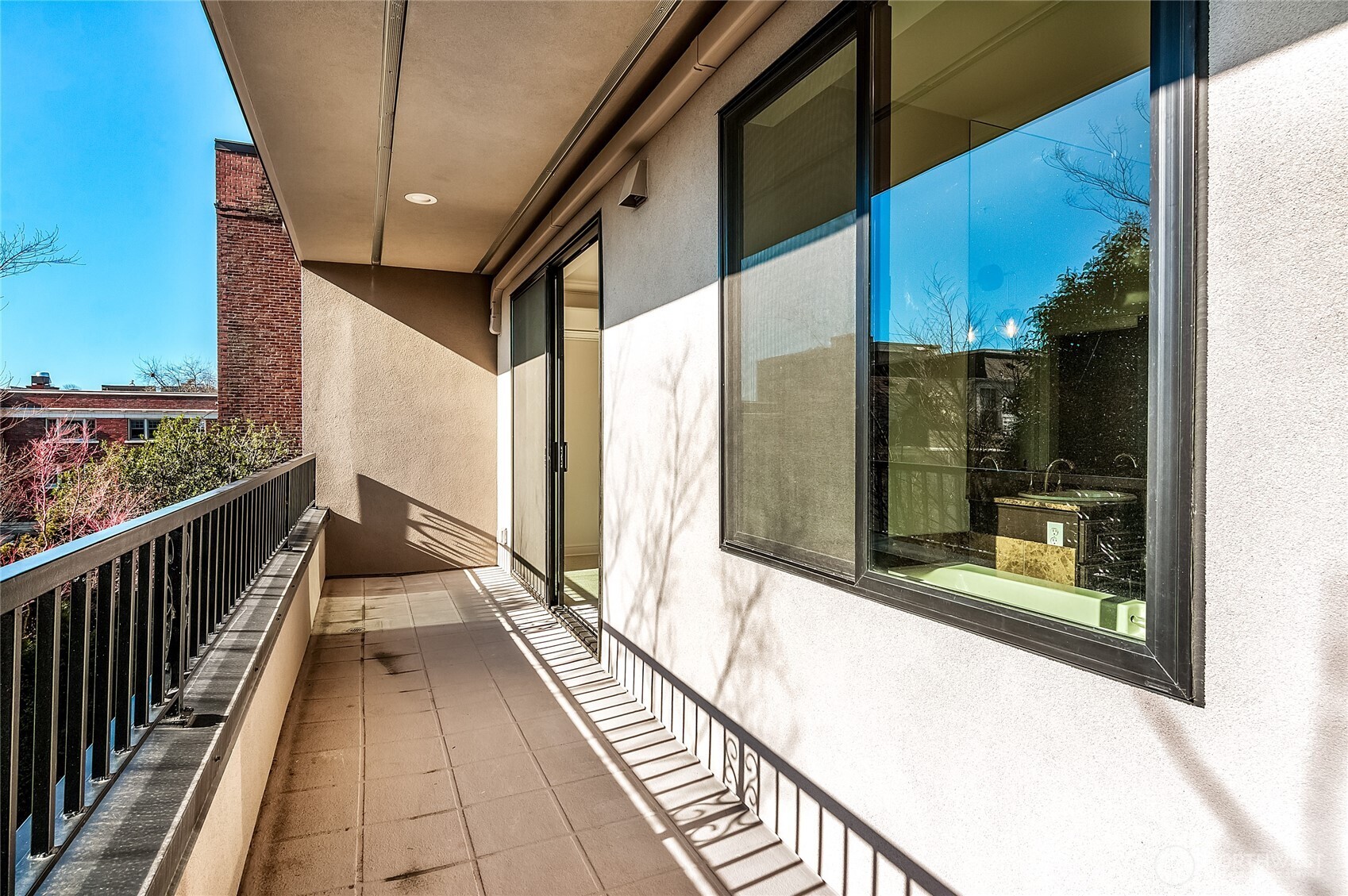 21 West Comstock Street, Unit 102 Seattle, WA 98119 - Photo 21 of 22 a view of balcony with wooden floor